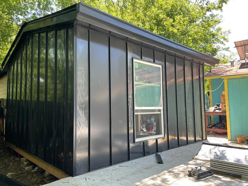 Black standing seam metal wall panels for Roof Inspection in Centerton